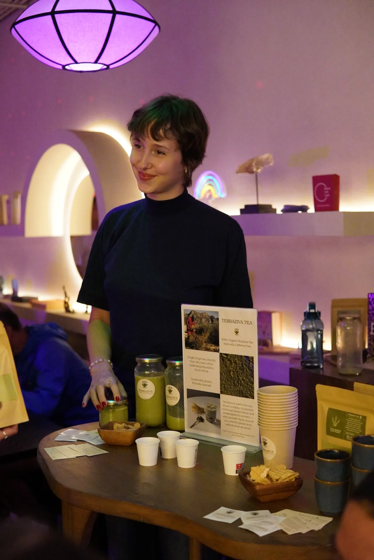 TerraZiva pop-up in a purple-lit space